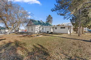 View of front facade with a mountain view and a front lawn ADU