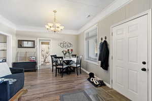 Dining space with a chandelier and dark hardwood / wood-style flooring MAIN HOUSE