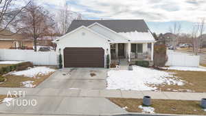 View of front of property with a garage and a porch