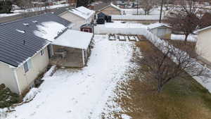 View of back yard with garden boxes & fruit trees