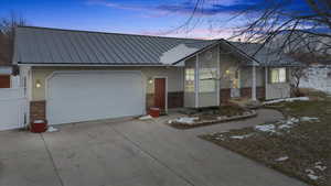 View of front of property with a garage