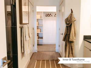 Bathroom with hardwood / wood-style floors and vanity