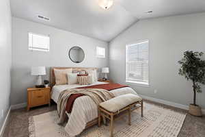 Primary bedroom w/ vaulted ceilings