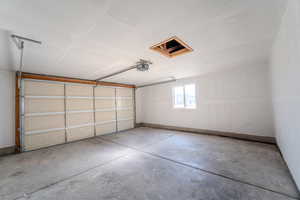 Garage featuring a garage door opener