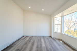 Spare room featuring hardwood / wood-style floors