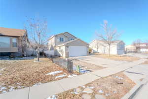 Front of property with a garage