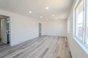 Spare room with light hardwood / wood-style flooring and a textured ceiling