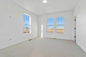 View of carpeted spare room