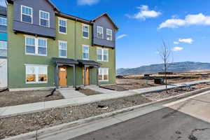 View of front of property with a mountain view