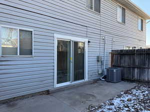 Exterior space featuring a patio area and central air condition unit