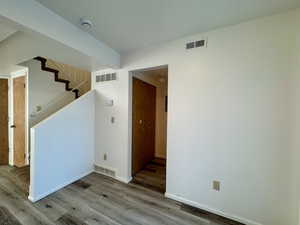 Spare room with wood-type flooring