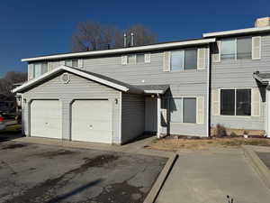 View of front of property with a garage