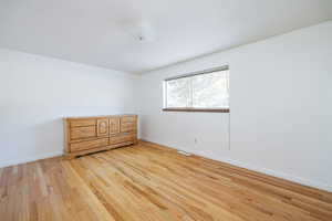 Spare room featuring light hardwood / wood-style flooring