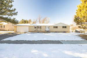 View of front of property featuring a garage