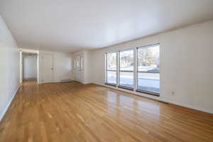 Empty room featuring light hardwood / wood-style flooring