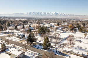 Snowy aerial view with a mountain view