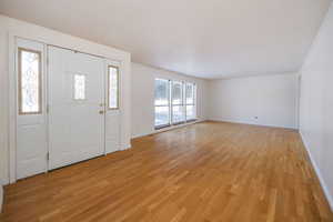 Foyer entrance featuring light hardwood / wood-style flooring