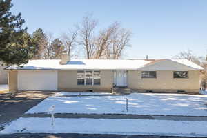 Single story home featuring a garage