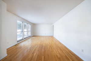 Unfurnished room with light hardwood / wood-style floors