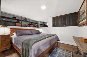 Bedroom featuring dark hardwood / wood-style floors