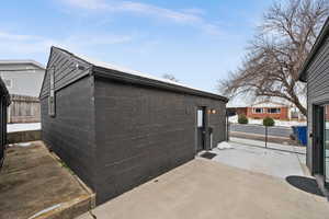 View of side of home with a patio