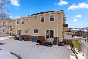 Rear of property featuring central AC