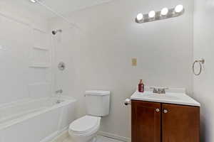 Full bathroom with tub / shower combination, toilet, and vanity