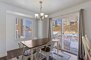 Dining room featuring a chandelier, a wealth of natural light, and hardwood / wood-style floors