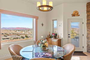 Dining space with a mountain view and light tile patterned floors