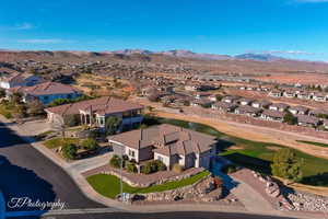 Birds eye view of property with a mountain view