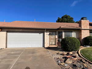 View of front facade featuring a garage