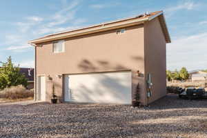 View of property exterior with a garage