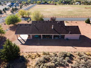 Birds eye view of property with a rural view