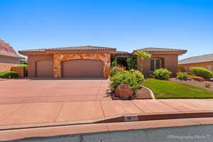 Mediterranean / spanish-style house with a garage