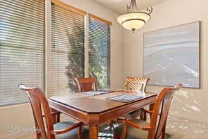 Dining space featuring light tile patterned flooring and a wealth of natural light