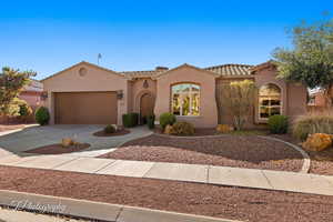 Mediterranean / spanish-style home featuring a garage