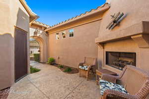 View of patio featuring an outdoor fireplace