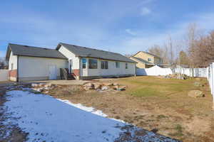 Snow covered property featuring a yard