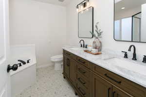 Bathroom featuring toilet and vanity