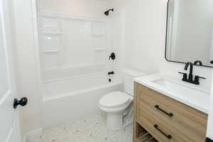 Full bathroom with vanity, toilet, and bathtub / shower combination