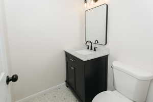 Bathroom with toilet and vanity