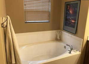 Bathroom with a tub to relax in