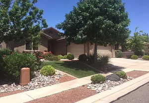 View of front facade featuring a garage