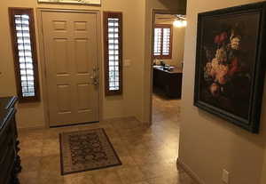 Foyer featuring ceiling fan