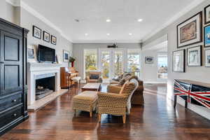 Living room has gorgeous fireplace and lots of natural light