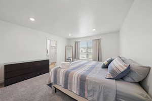 Carpeted bedroom with ensuite bath