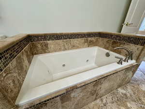 Bathroom with tiled tub