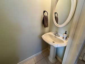 Bathroom featuring sink and tile patterned floors