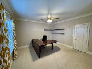 Office featuring ceiling fan, light colored carpet, and ornamental molding