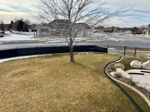 View of yard layered in snow